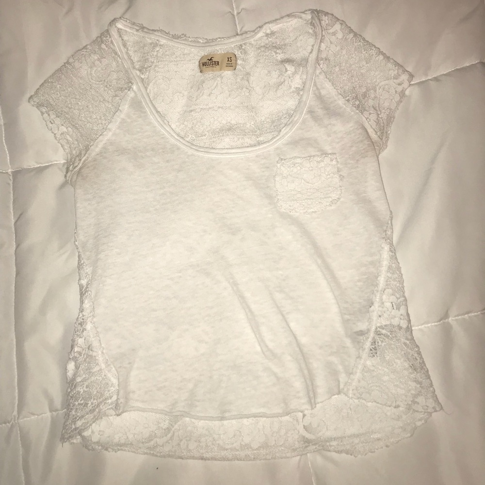 White top with lace shoulder and see through back